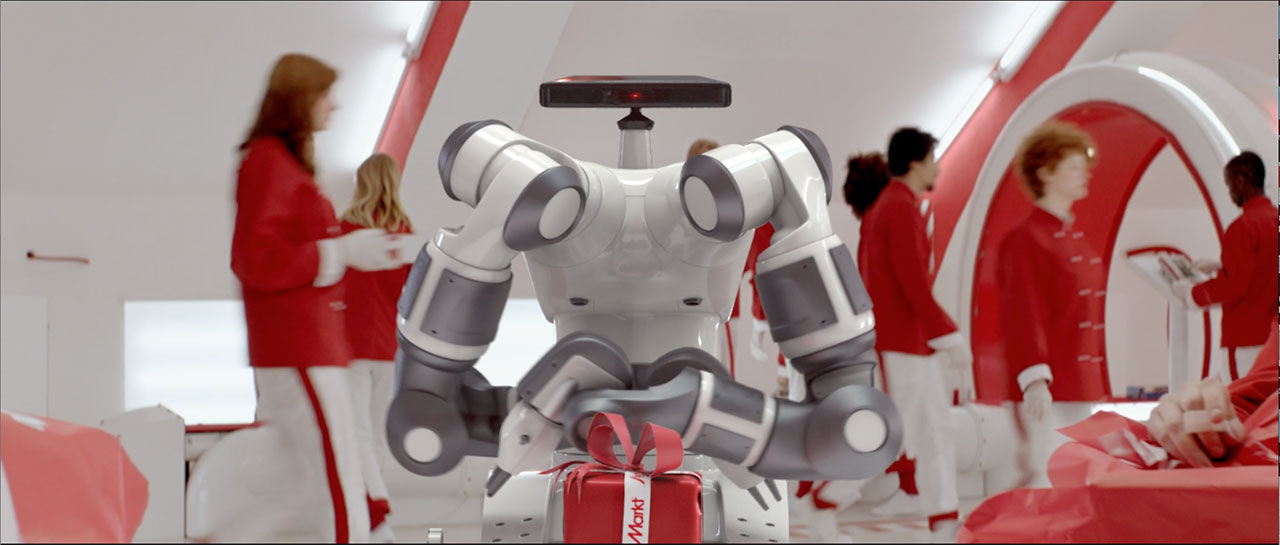 Roboten YuMi slår in julklappar